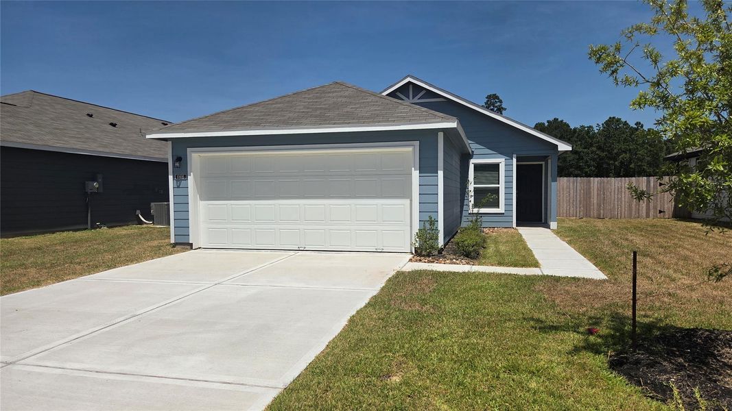 Front exterior of a new home in , Conroe, TX, highlighting curb appeal (Image 1). Front exterior of a new home in , Conroe, TX, highlighting curb appeal (Image 1).