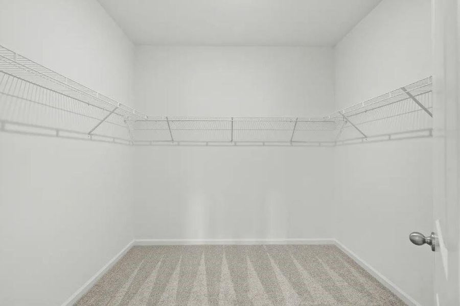 Walk-in Closet in Primary Bedroom - Representative Photo Walk-in Closet in Primary Bedroom - Representative Photo