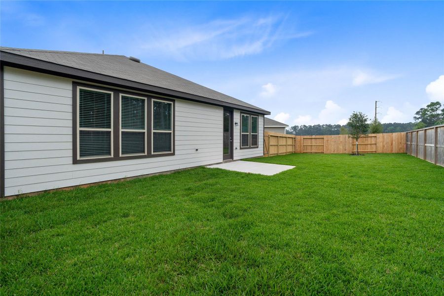This generous, fully-fenced backyard is designed for both relaxation and recreation. This generous, fully-fenced backyard is designed for both relaxation and recreation.
