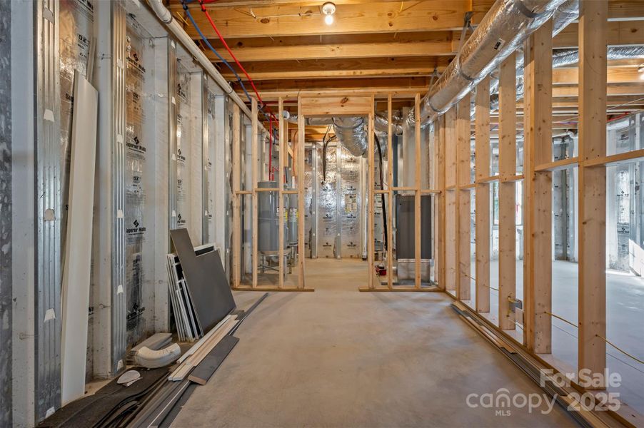 Utility room with two water heaters, air handler and radon mitigation system