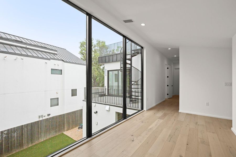 Entryway with hardwood / wood-style floors and recessed lighting
