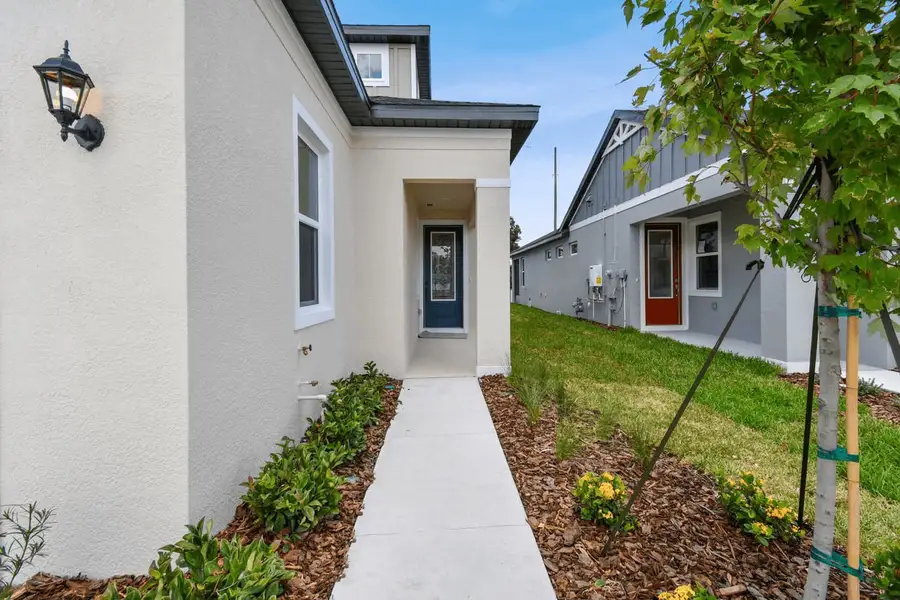 Exterior details and patio area of a home in Fairway Pointe - 55+ Villa Community, Sun City Center (Image 3).
