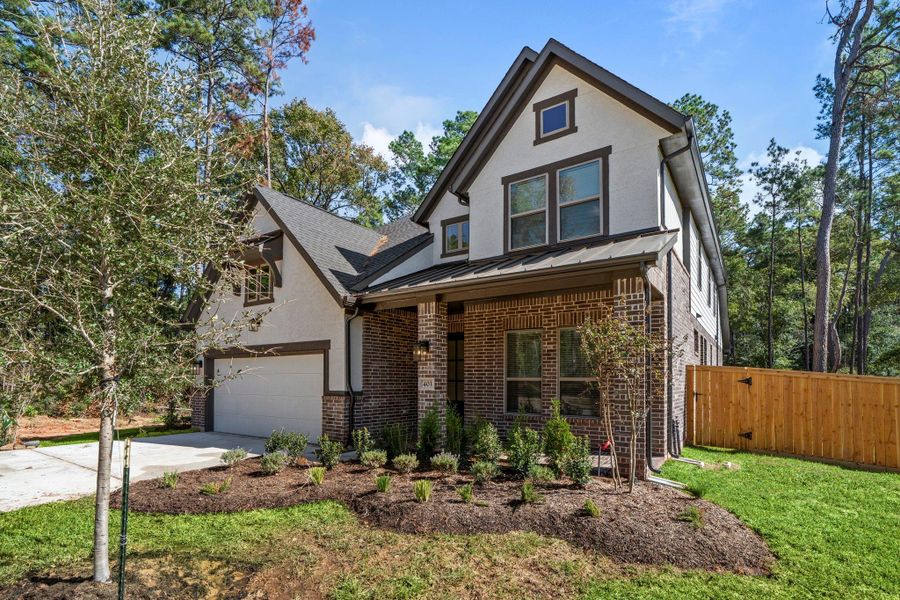 Front exterior of a new home in The Woodlands Hills, Willis, TX, highlighting curb appeal (Image 2).