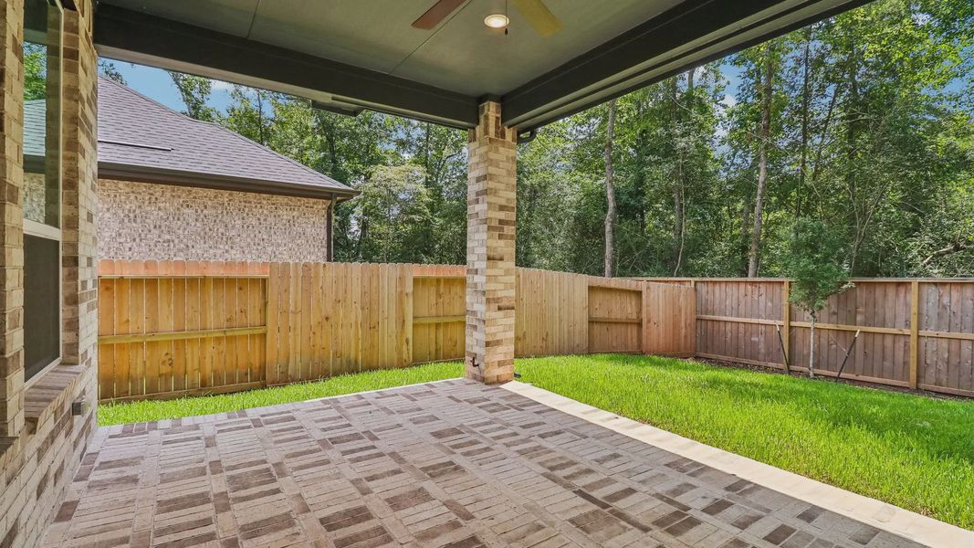 Exterior details and patio area of a home in The Woodland Hills 50', Willis (Image 3). Exterior details and patio area of a home in The Woodland Hills 50', Willis (Image 3).