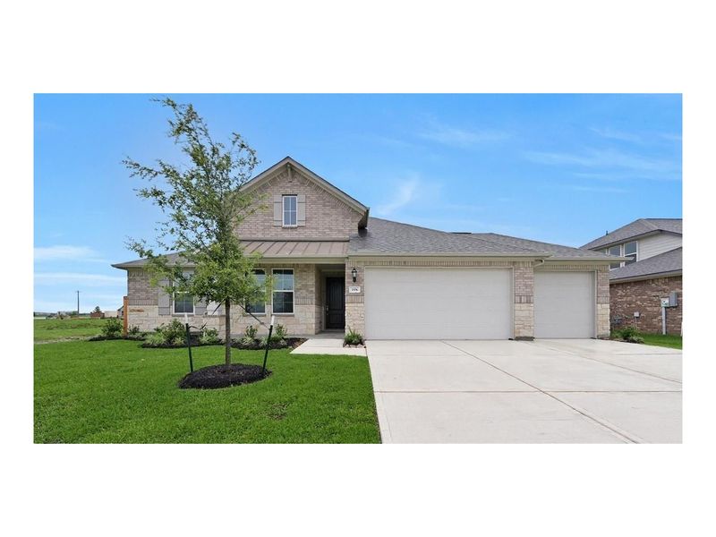 Front exterior of a new home in Lago Mar, Santa Fe, TX, highlighting curb appeal (Image 1).