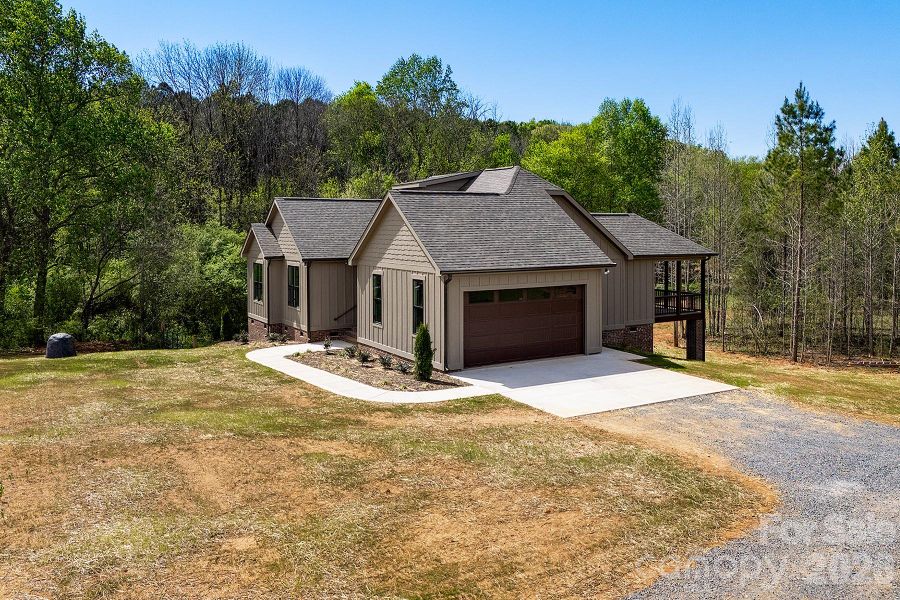 Front exterior of a new home in , Norwood, NC, highlighting curb appeal (Image 27).