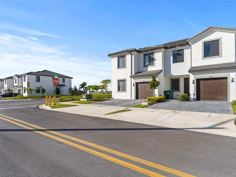 Front exterior of a new home in , Homestead, FL, highlighting curb appeal (Image 22). Front exterior of a new home in , Homestead, FL, highlighting curb appeal (Image 22).