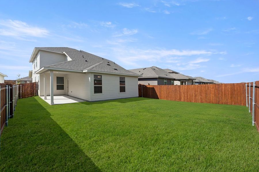 Front exterior of a new home in Creekside Ranch, Blue Ridge, TX, highlighting curb appeal (Image 12).