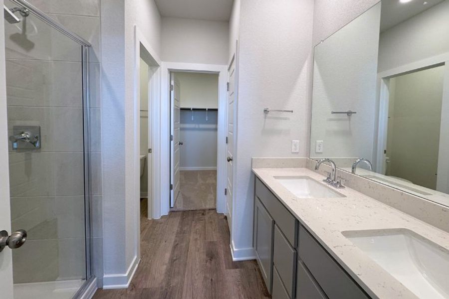 A bathroom with a glass shower.