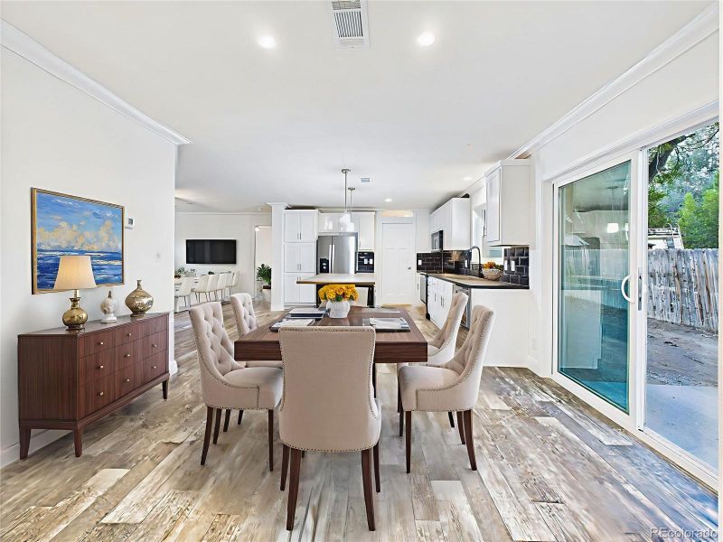 Virtually Staged Open-concept layout allows the kitchen, dining, and living areas to connect seamlessly.