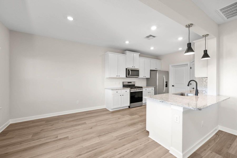 Furnished interior view inside a new home in Sunterra, Katy (Image 4).