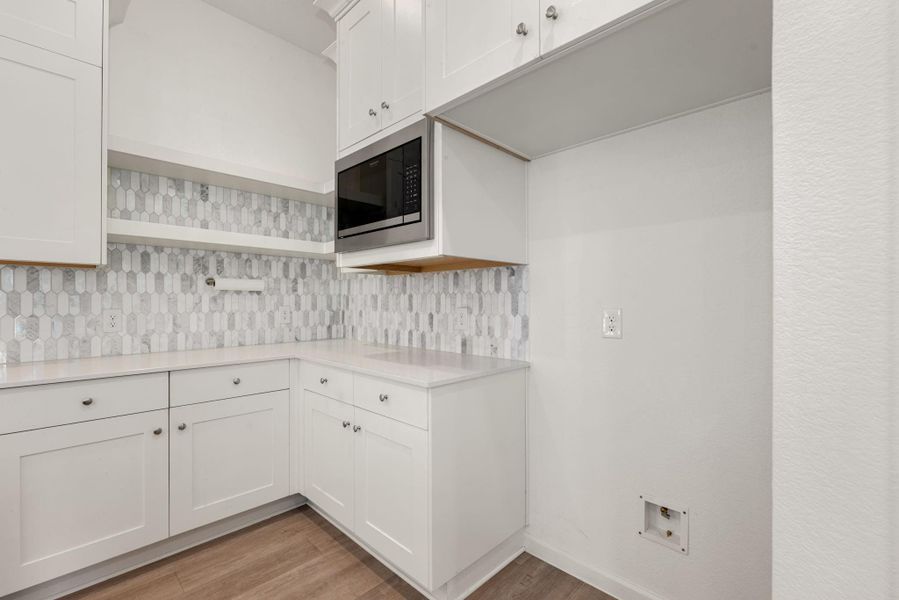 Furnished interior view inside a new home in Sunterra, Katy (Image 12).