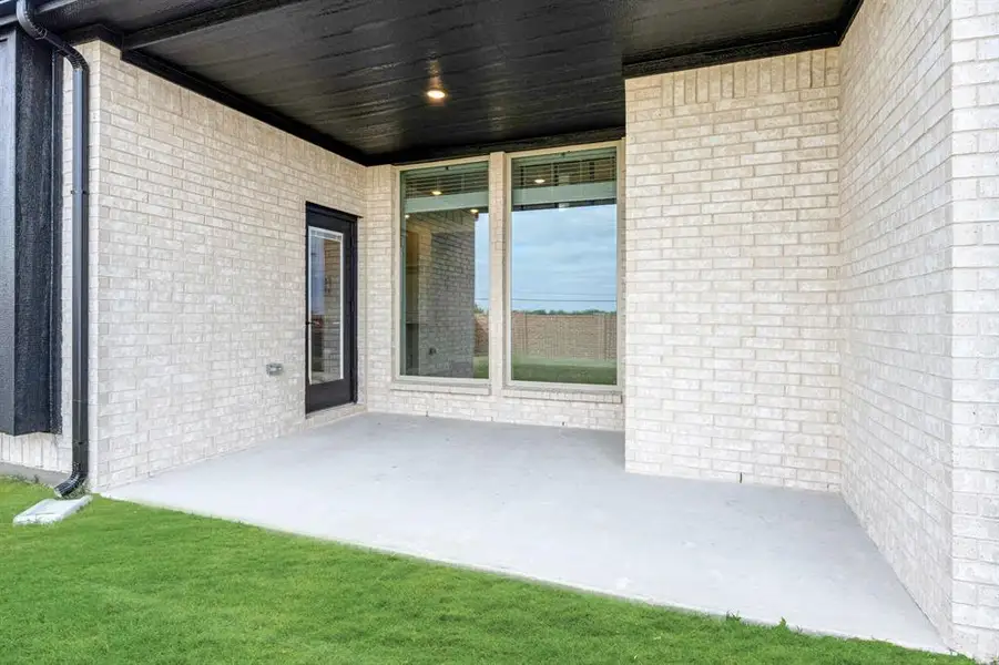 Exterior details and patio area of a home in Devonshire, Forney (Image 4).