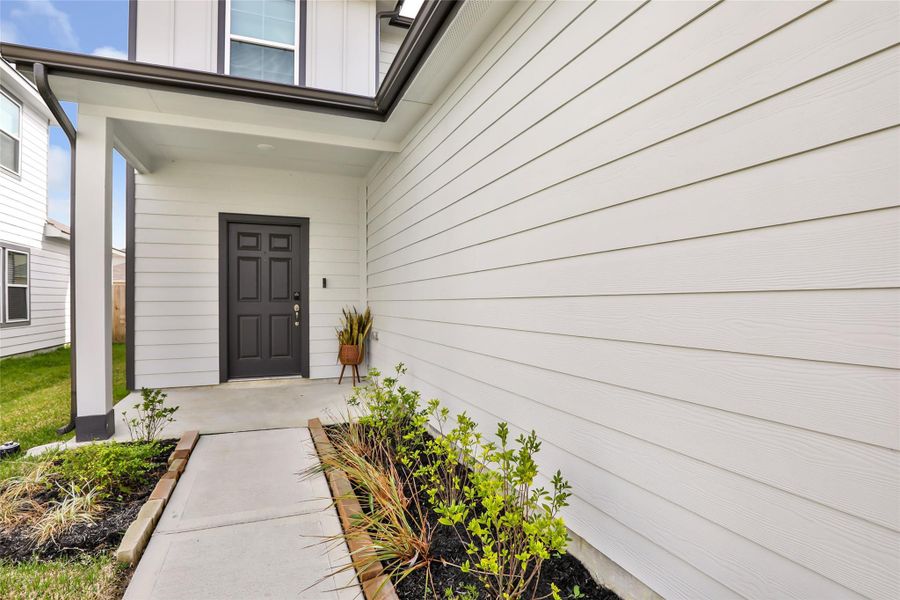 Exterior details and patio area of a home in Barrett Crossing, Crosby (Image 3).