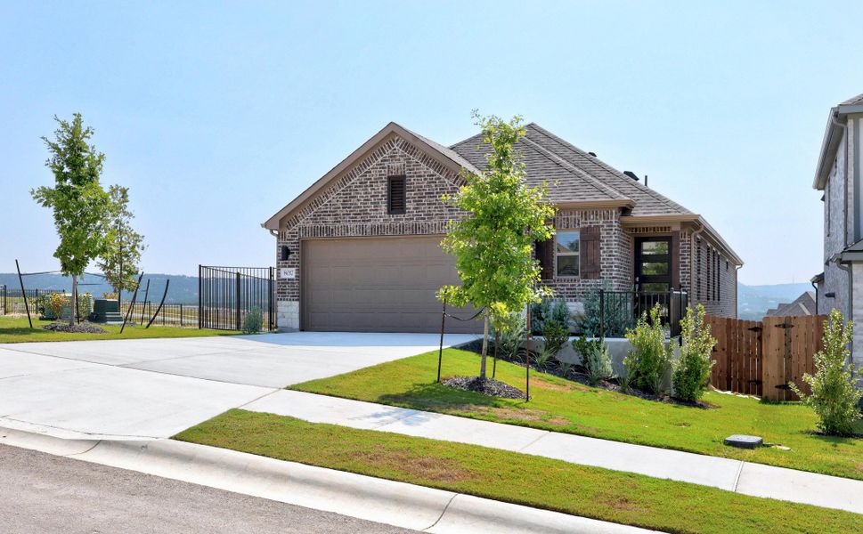 Front exterior of a new home in Lakeside at Tessera, Lago Vista, TX, highlighting curb appeal (Image 19).