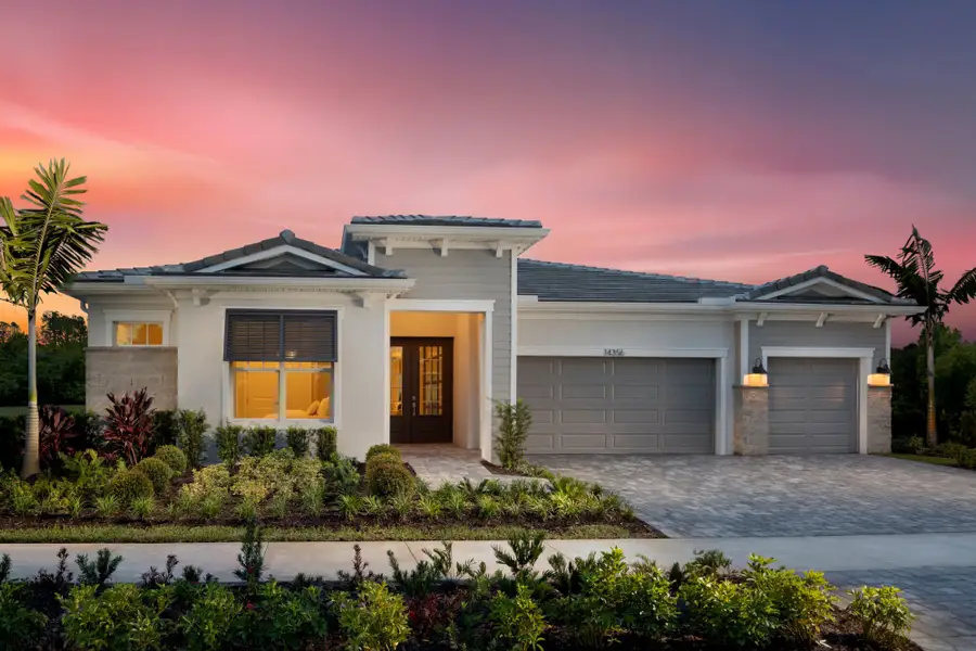 Front exterior of a new home in Tradition, Port St. Lucie, FL, highlighting curb appeal (Image 2).