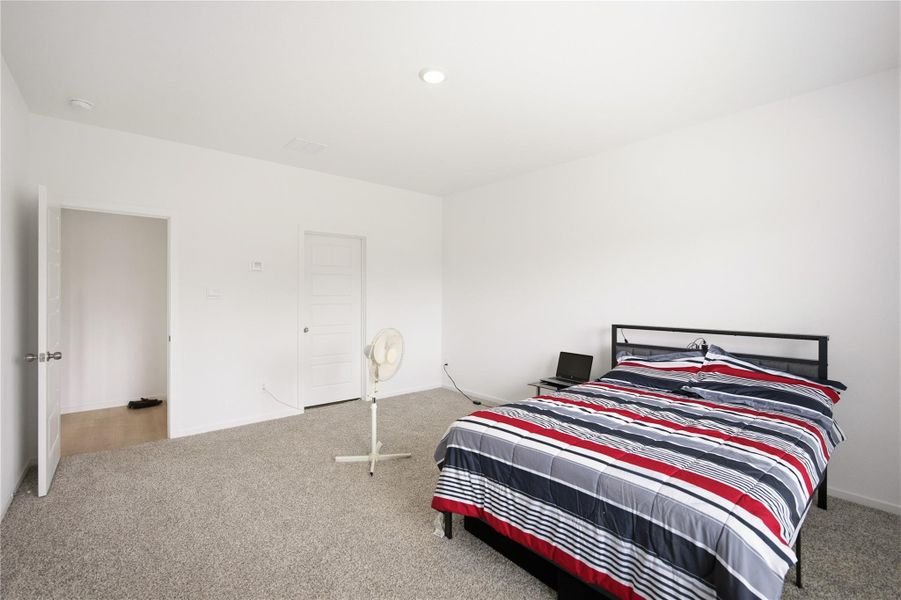 Primary bedroom — Spacious primary suite with natural light. Primary bedroom — Spacious primary suite with natural light.