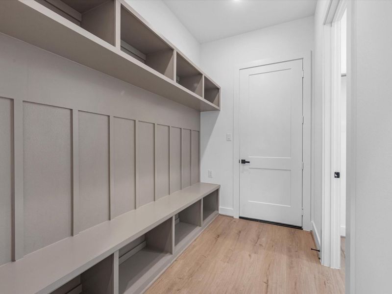 Expansive utility rack and storage at front entry. Expansive utility rack and storage at front entry.