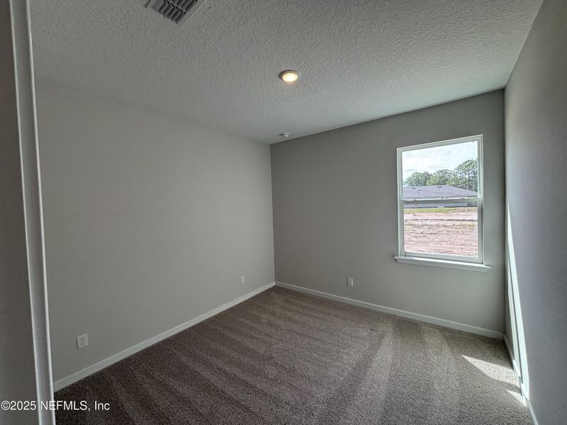 Spacious, unfurnished interior of a new home in The Magnolia Series at Reserve East, Flagler Beach (Image 12).