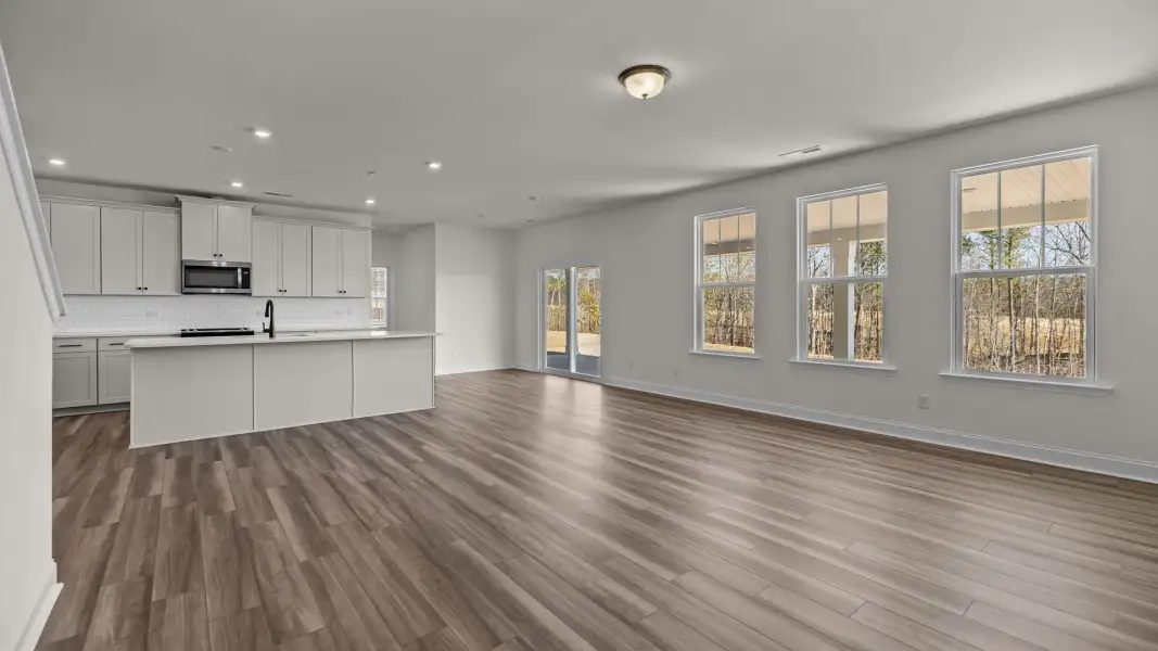 Spacious and bright open concept with large windows and elevated ceiling in the Norris Design by DRB Homes in York, SC Spacious and bright open concept with large windows and elevated ceiling in the Norris Design by DRB Homes in York, SC