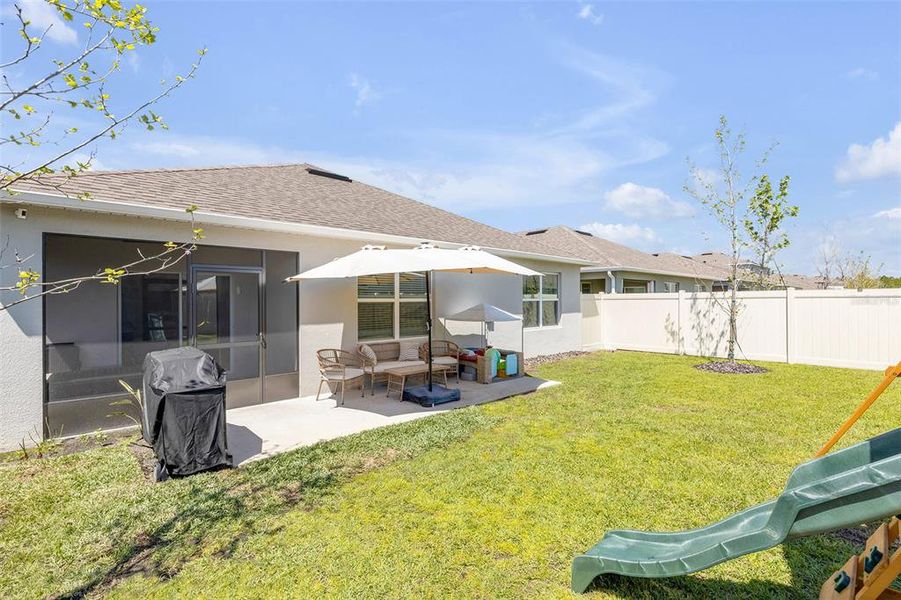 Exterior details and patio area of a home in Groveside at Ormond Station, Ormond Beach (Image 4).