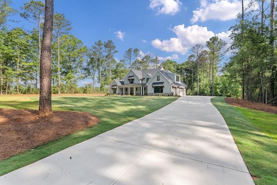 Front exterior of a new home in , Carrollton, GA, highlighting curb appeal (Image 25).