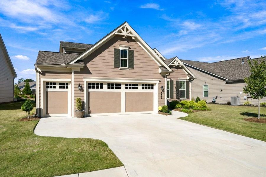 Front exterior of a new home in , Hoschton, GA, highlighting curb appeal (Image 24).