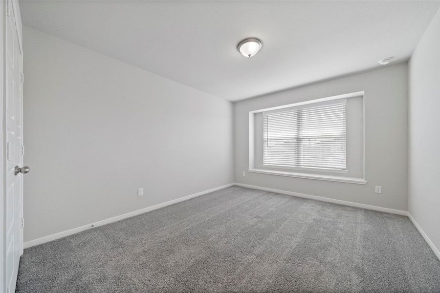 Spacious, unfurnished interior of a new home in Sunterra, Katy (Image 21).