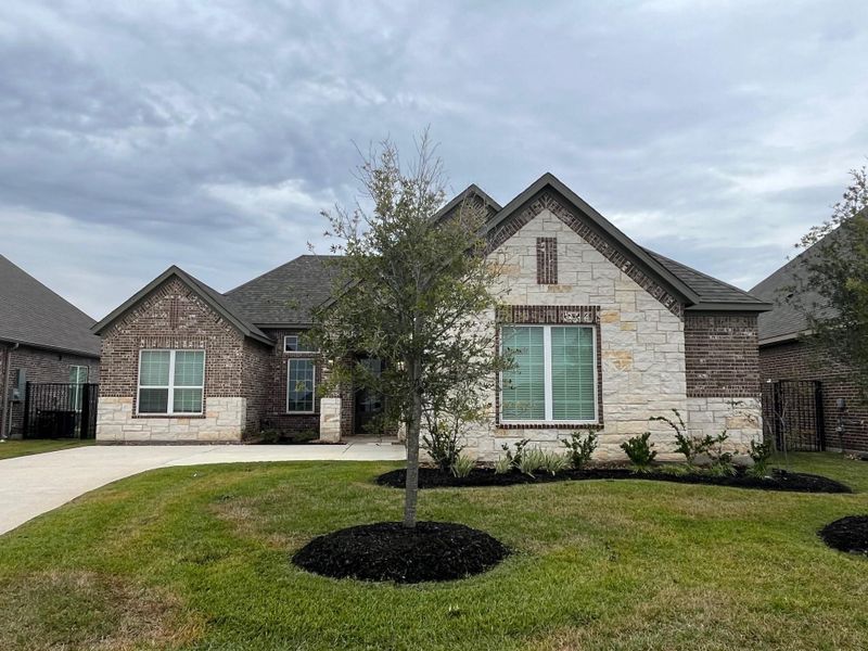 Front exterior of a new home in Sierra Vista, Iowa Colony, TX, highlighting curb appeal (Image 2). Front exterior of a new home in Sierra Vista, Iowa Colony, TX, highlighting curb appeal (Image 2).
