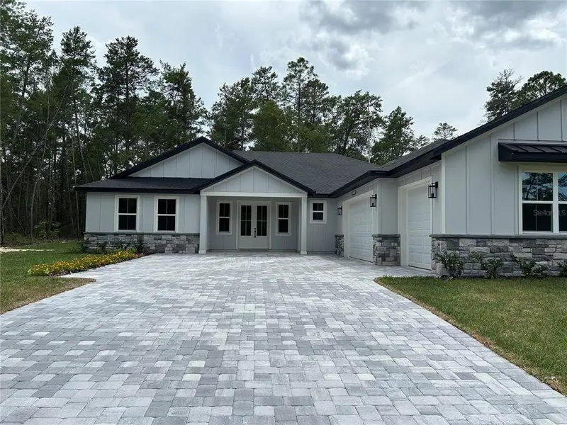 Front exterior of a new home in , Dunnellon, FL, highlighting curb appeal (Image 1). Front exterior of a new home in , Dunnellon, FL, highlighting curb appeal (Image 1).