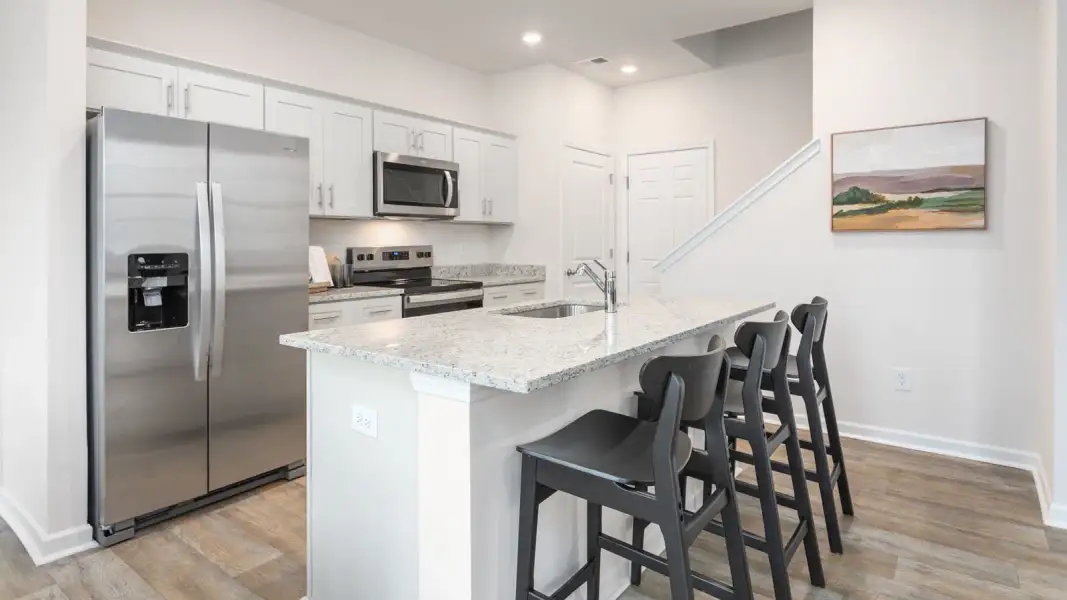 Furnished interior view inside a new home in North Village Townes, Greensboro (Image 10).