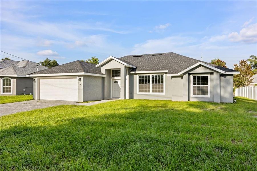 Front exterior of a new home in , Deland, FL, highlighting curb appeal (Image 16).