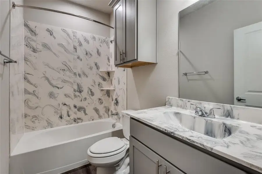 Bathroom featuring vanity and shower / tub combination