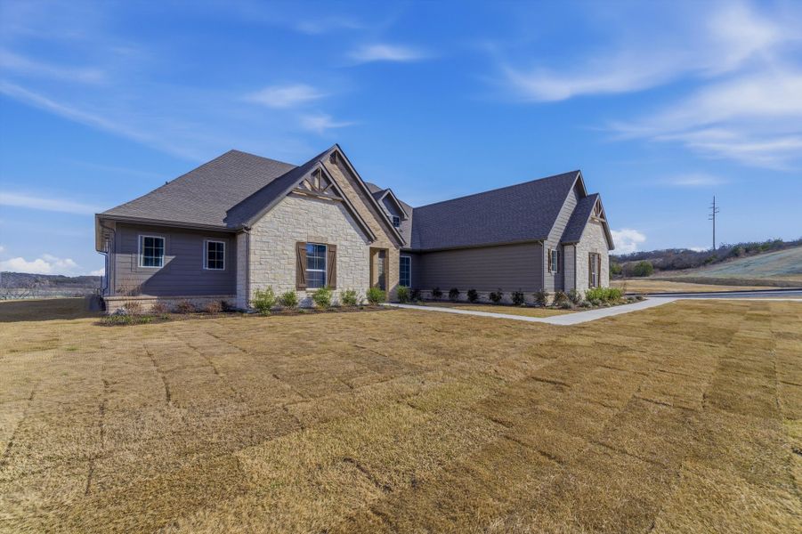 Front exterior of a new home in Eagle Ridge Estates, Weatherford, TX, highlighting curb appeal (Image 21).