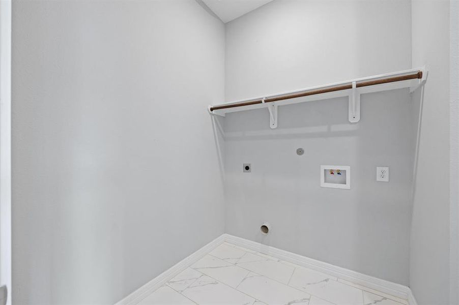 Convenient in-house laundry room for easy access.