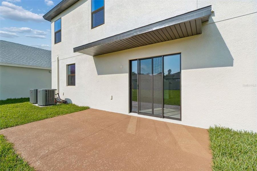Exterior details and patio area of a home in Avalon West, Spring Hill (Image 35).