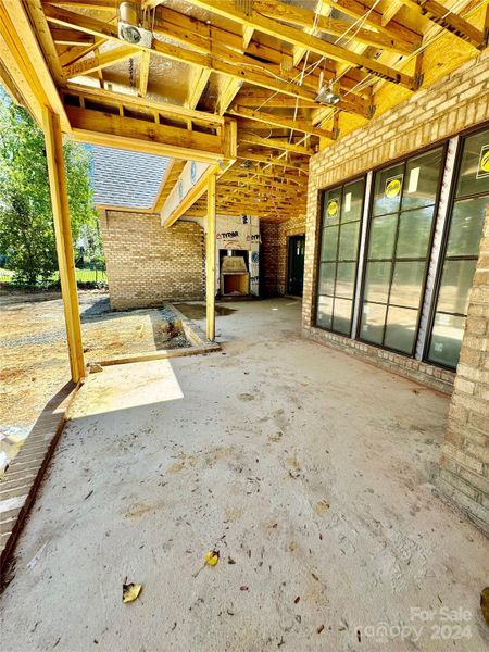 Outdoor Patio features bluestone pavers, a grill station, outdoor heaters & Masonlite wood burning fireplace w/ gas starter.