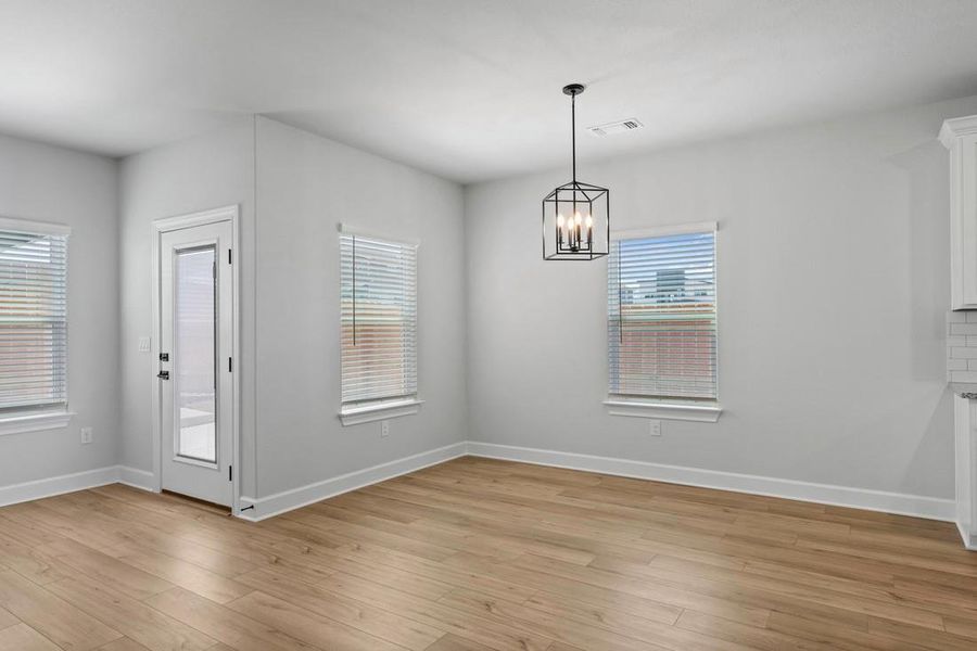 Adjacent to the family room, the dining room sets the stage for family meals and celebrations. It's a place where conversations flow as effortlessly as the layout.