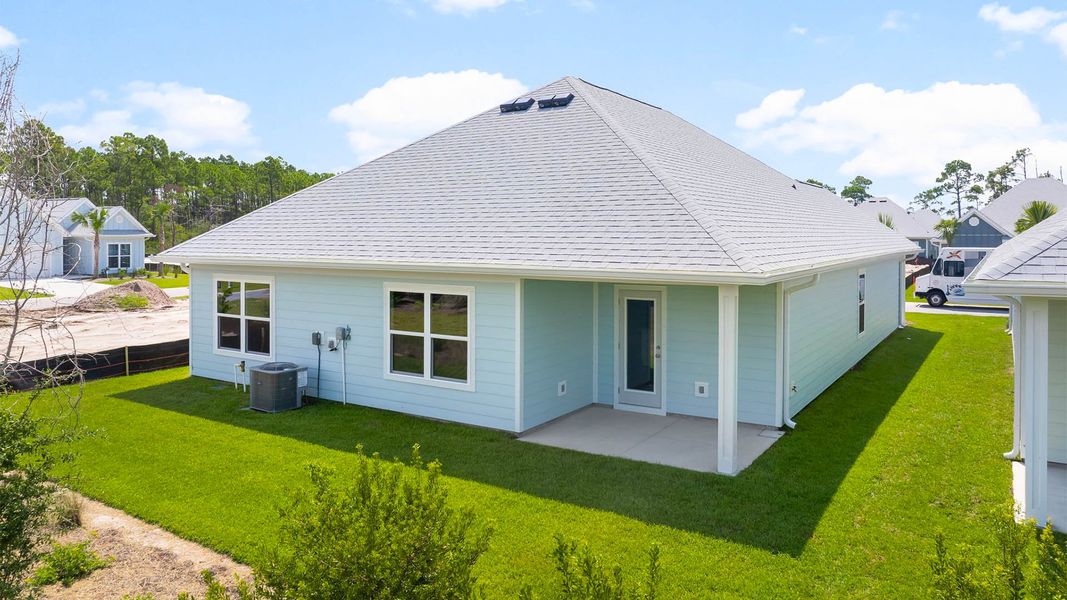 Front exterior of a new home in Windmark Beach, Port Saint Joe, FL, highlighting curb appeal (Image 16).