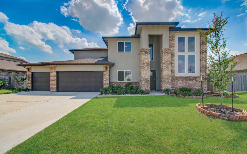 Front exterior of a new home in Parks Edge, Missouri City, TX, highlighting curb appeal (Image 22). Front exterior of a new home in Parks Edge, Missouri City, TX, highlighting curb appeal (Image 22).