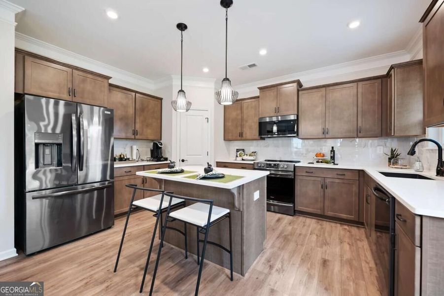 Furnished interior view inside a new home in Cobblestone Crossing Commons, Byron (Image 8).
