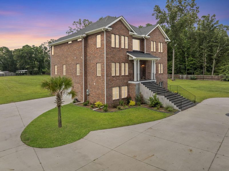 Front exterior of a new home in , Summerville, SC, highlighting curb appeal (Image 32). Front exterior of a new home in , Summerville, SC, highlighting curb appeal (Image 32).