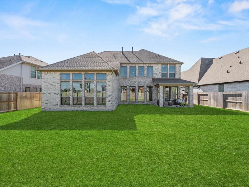 Just a straight on view of the back of the house from the brick wall. This is a 'blank canvas'! Want a flower garden or perhaps grow some veggies or plant a fruit tree or two. It will get plenty of sun as the day progresses. (morning photos)