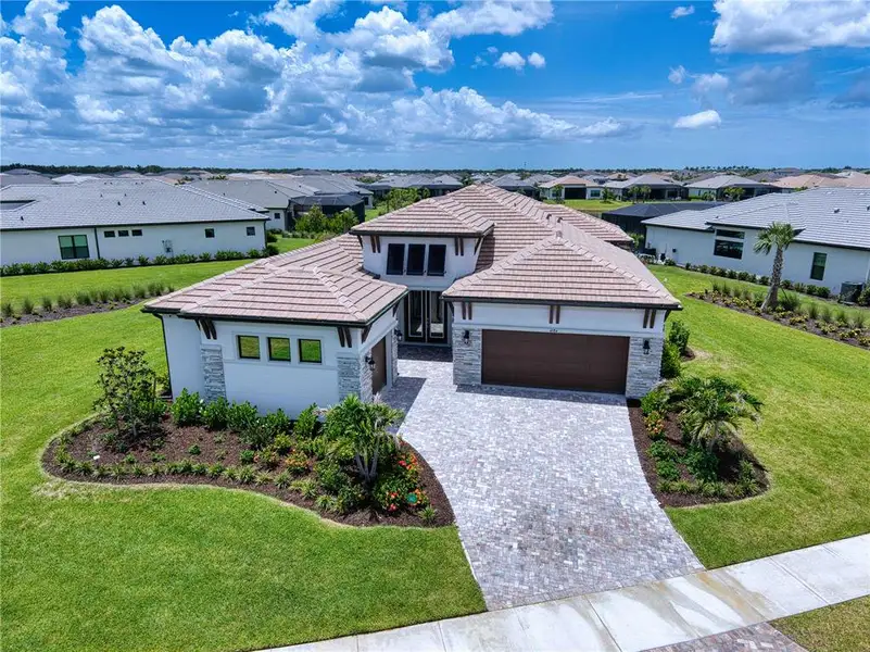 Front exterior of a new home in , Sarasota, FL, highlighting curb appeal (Image 19). Front exterior of a new home in , Sarasota, FL, highlighting curb appeal (Image 19).