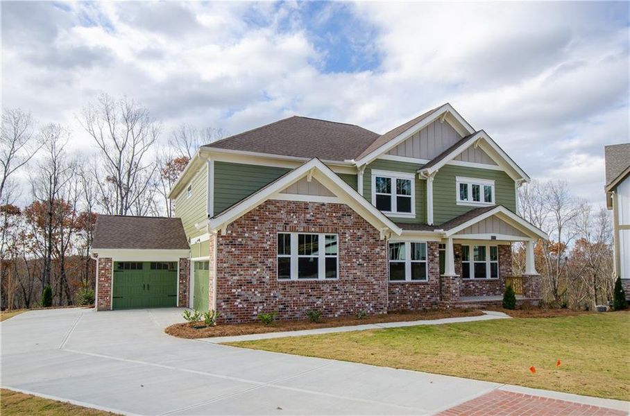 Front exterior of a new home in , Ball Ground, GA, highlighting curb appeal (Image 24).