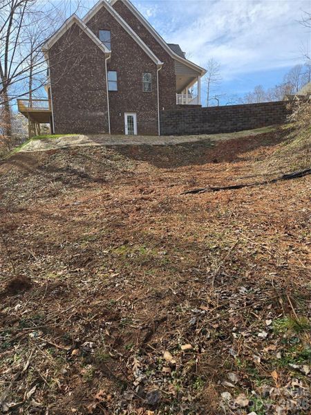 Side of the house, majority of lot is tucked away and private.