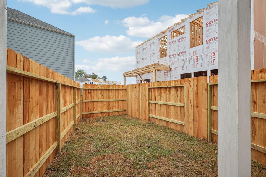 Exterior details and patio area of a home in Pinewood Trails - City Series, Atascocita (Image 25).