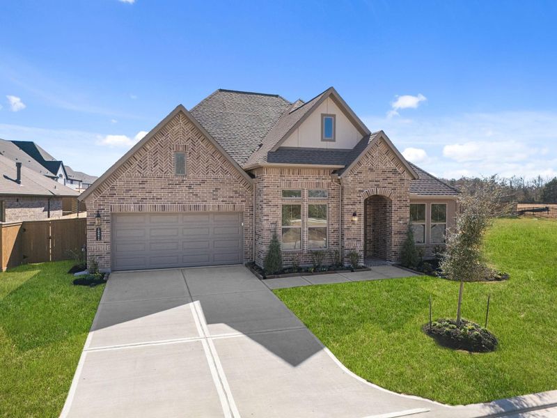 Front exterior of a new home in Chambers Creek, Willis, TX, highlighting curb appeal (Image 22).