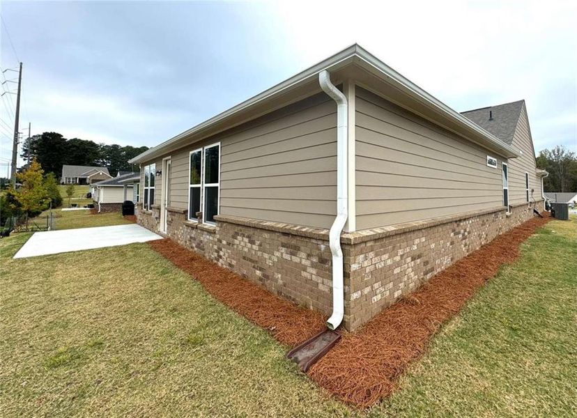Front exterior of a new home in Lakecrest, Buford, GA, highlighting curb appeal (Image 1).