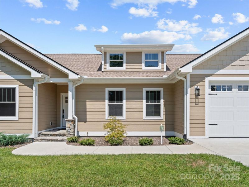 Front exterior of a new home in , Hendersonville, NC, highlighting curb appeal (Image 22). Front exterior of a new home in , Hendersonville, NC, highlighting curb appeal (Image 22).